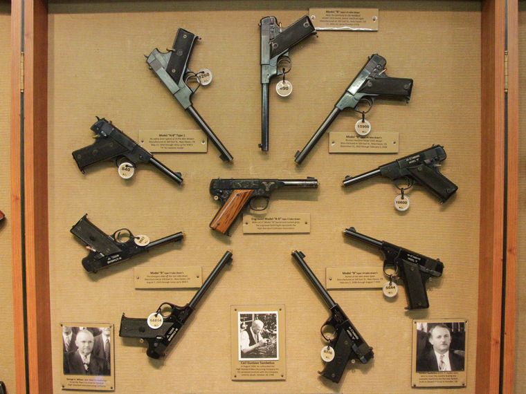 A collection of collectable firearms laid out